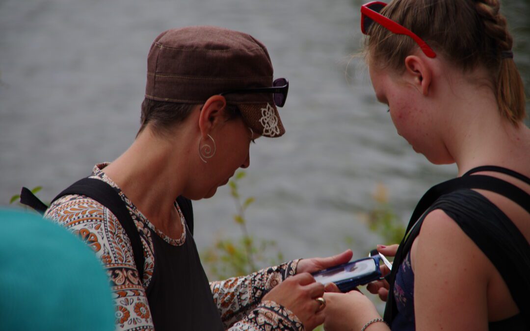 mother daughter checking dexcom blood sugars